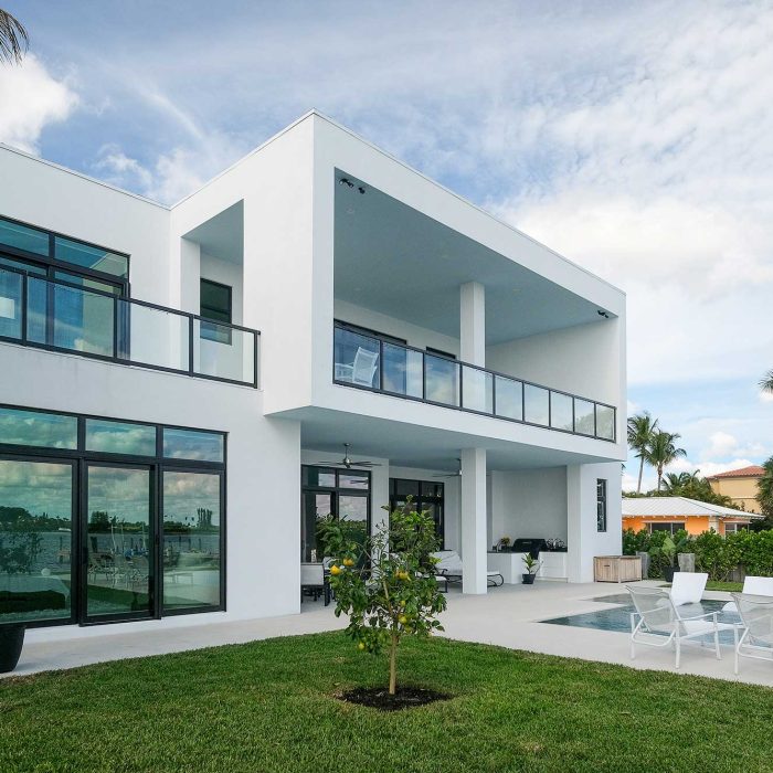 Modern white house with pool and garden