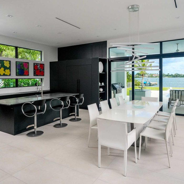Modern kitchen with lake view and art decor.