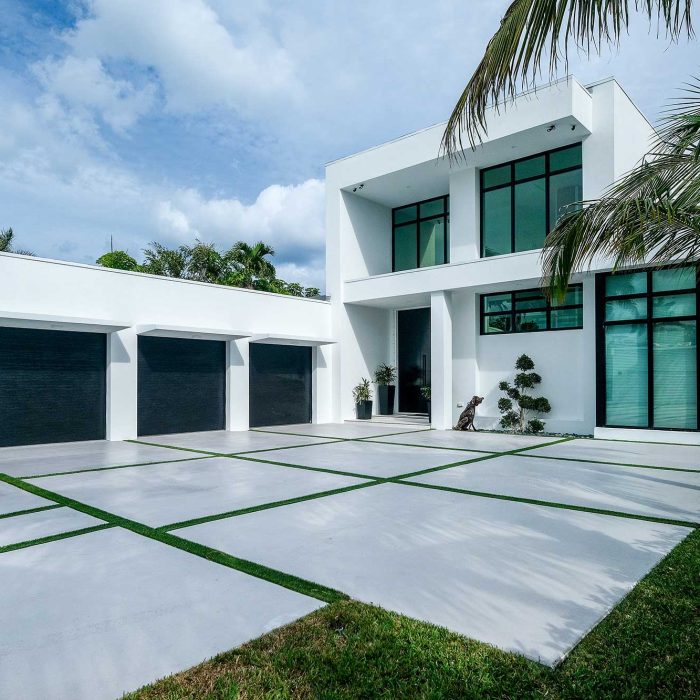 Modern white house with three-car garage