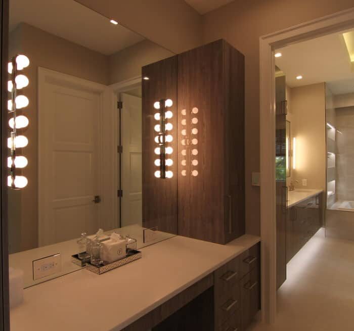 Luxurious modern bathroom with mirror lighting.