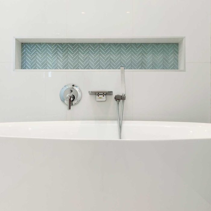 Modern bathroom with white freestanding bathtub.