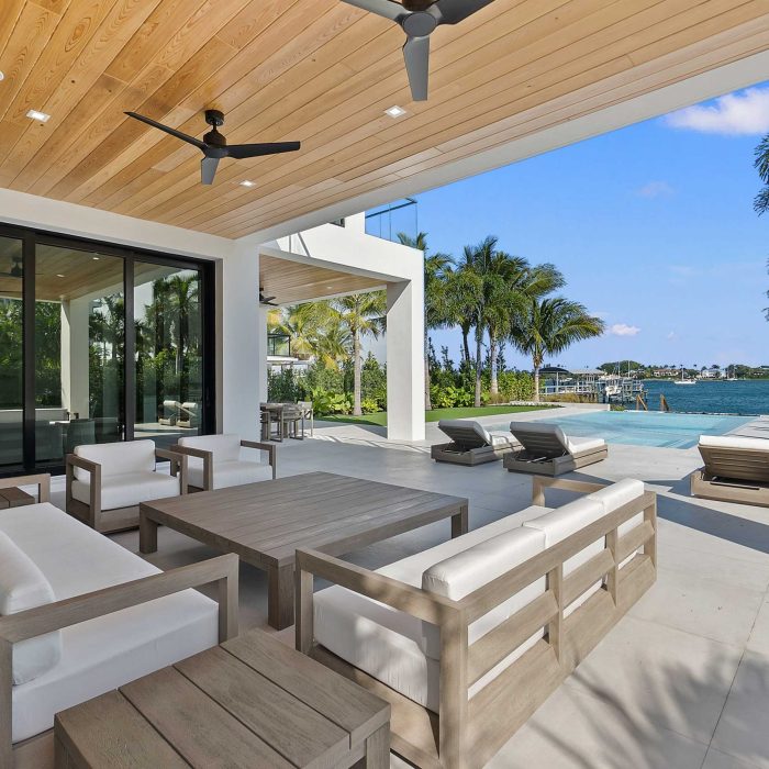 Luxury patio overlooking pool and waterfront view