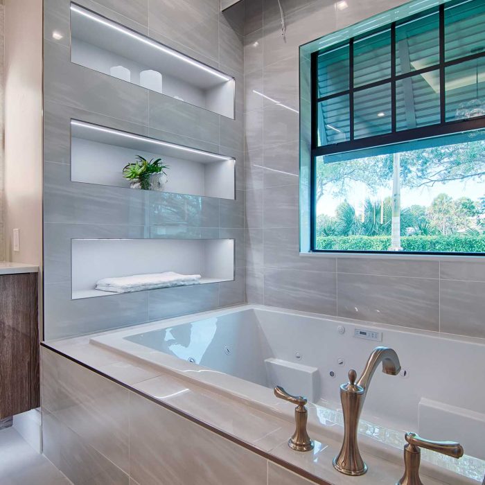 Modern bathroom with large bathtub and window view