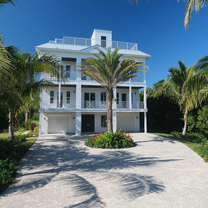 Modern beach house with palm trees