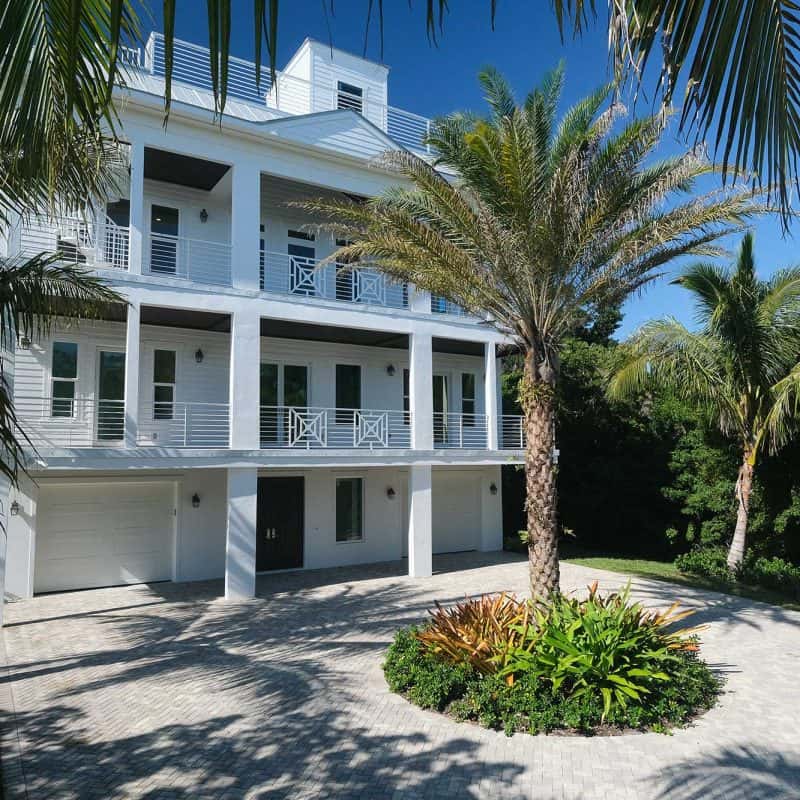 Modern tropical house with palm trees