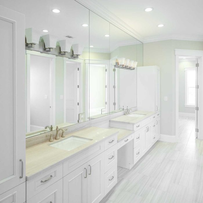 Modern bathroom with double sinks and large mirrors