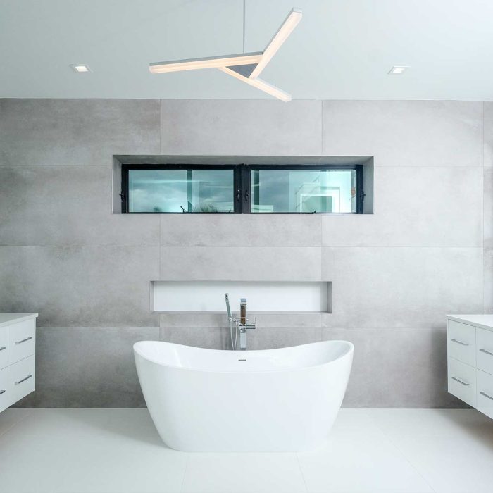 Minimalist bathroom with freestanding bathtub