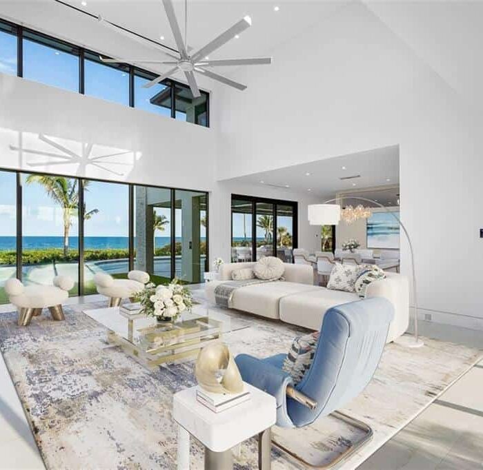 Modern living room with ocean view windows.
