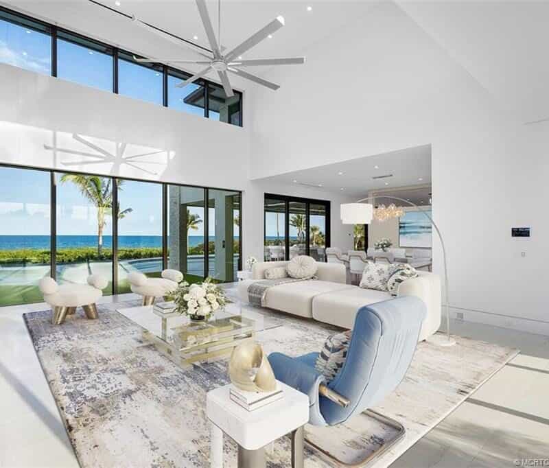 Modern living room with ocean view windows.