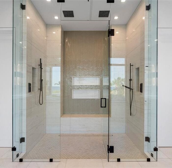 Luxury glass shower with dual showerheads.