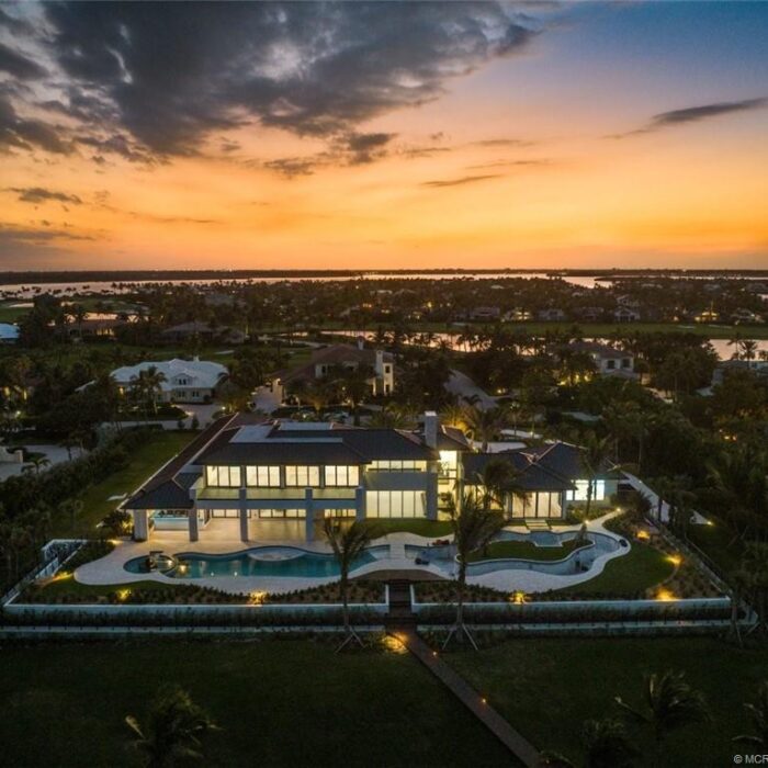 Luxury house and pool at sunset.