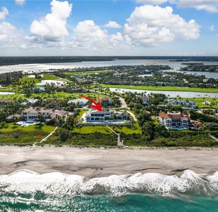 Aerial view of beachside residential area with arrow.