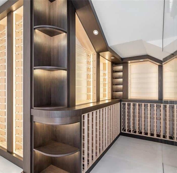 Modern wine cellar with wooden racks and shelves.