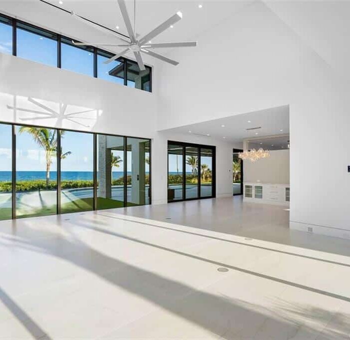 Spacious modern living room with ocean view.