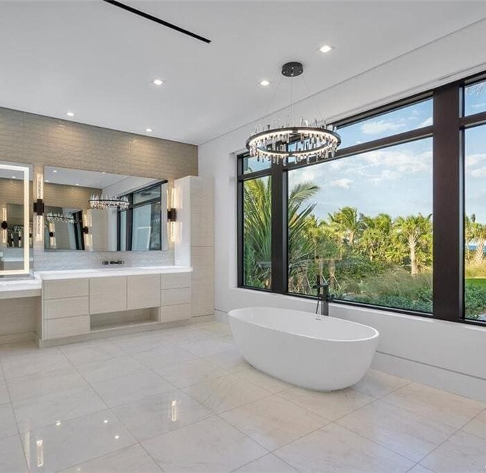 Luxury bathroom with ocean view, modern design.