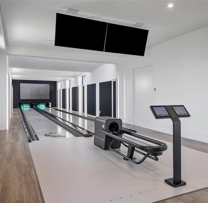 Modern indoor bowling alley with electronic scoreboard