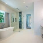 Modern bathroom with bathtub and glass shower