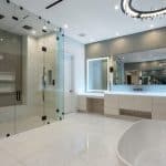 Luxurious modern bathroom with glass shower and bathtub.