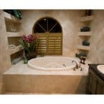 Luxury bathroom with whirlpool tub and floral decor.