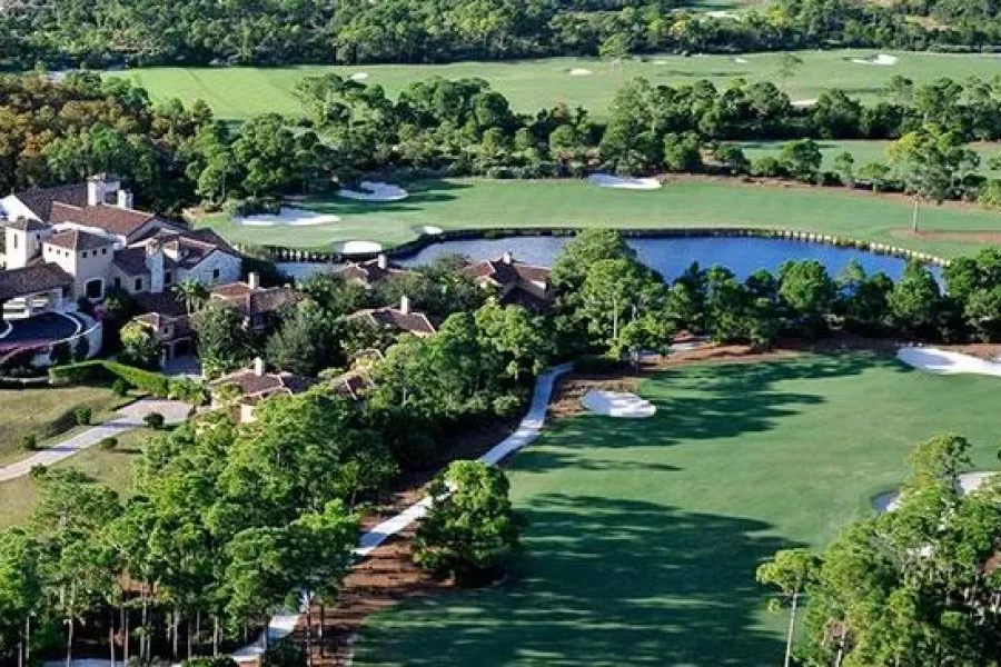 Aerial view of a lush golf course landscape.