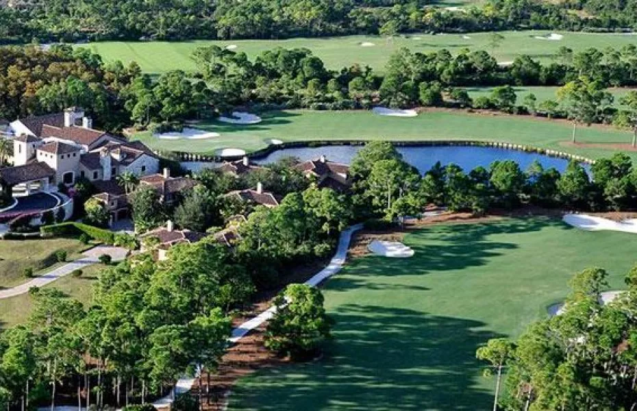 Aerial view of a lush golf course landscape.