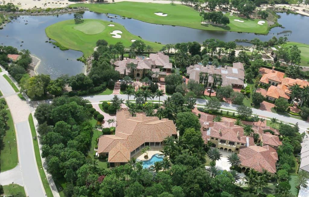Aerial view of luxurious homes by a golf course