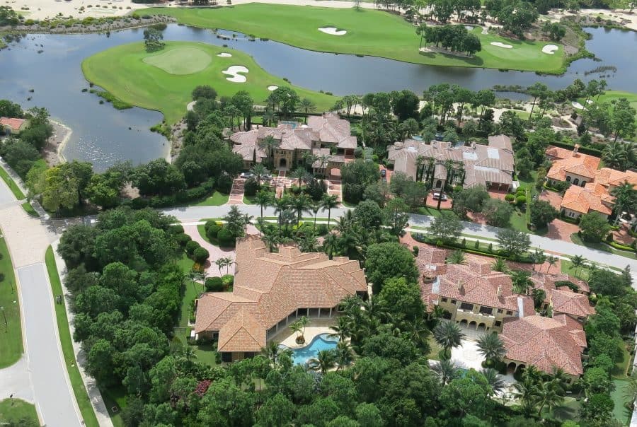 Aerial view of luxurious homes by a golf course
