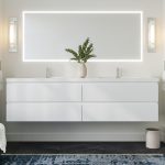 Modern bathroom with double sink and lighted mirror.