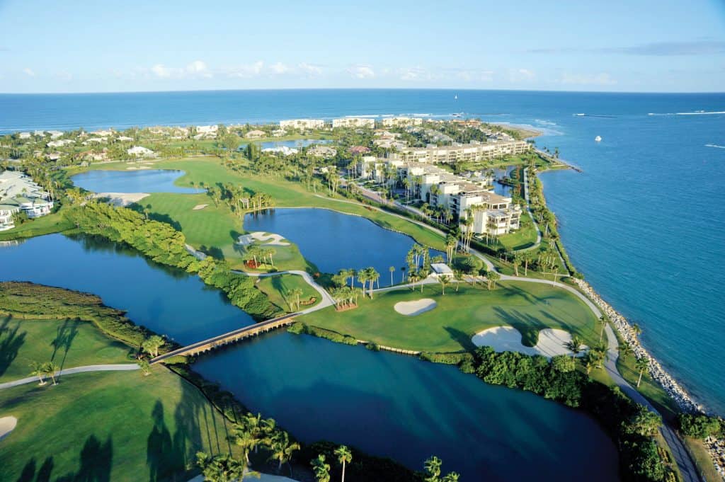 Aerial view of coastal golf course and ocean