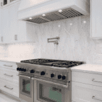 Modern kitchen with stainless steel stove and hood