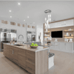Modern kitchen with island and pendant lighting.