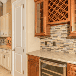 Modern kitchen with wine rack and backsplash tiles