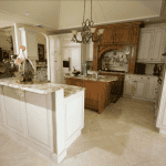 Luxurious kitchen with marble countertops and wooden cabinets.