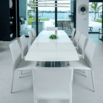Modern dining area with waterfront view.