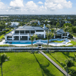 Luxury mansion with pool and lush landscape