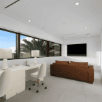 Modern home office with large windows.
