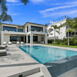 Modern house with pool and palm trees