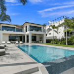 Modern house with pool and palm trees